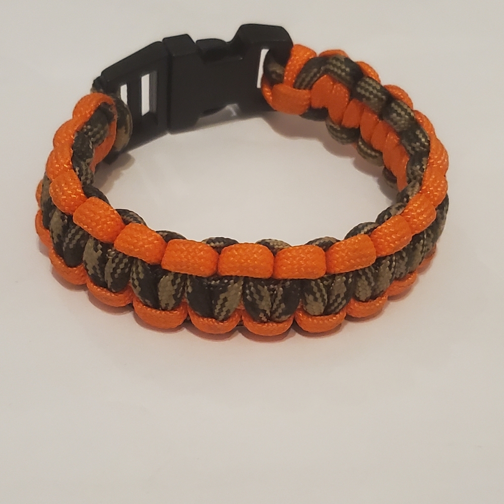 Orange & Brown/Tan Paracord Bracelet. It is also known as a Survival Bracelet